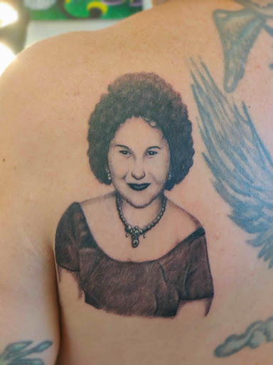 Explore dolphin tattoo ideas for females, creative tattoo ideas in Hebron, available at Explosive Ink Tattoo