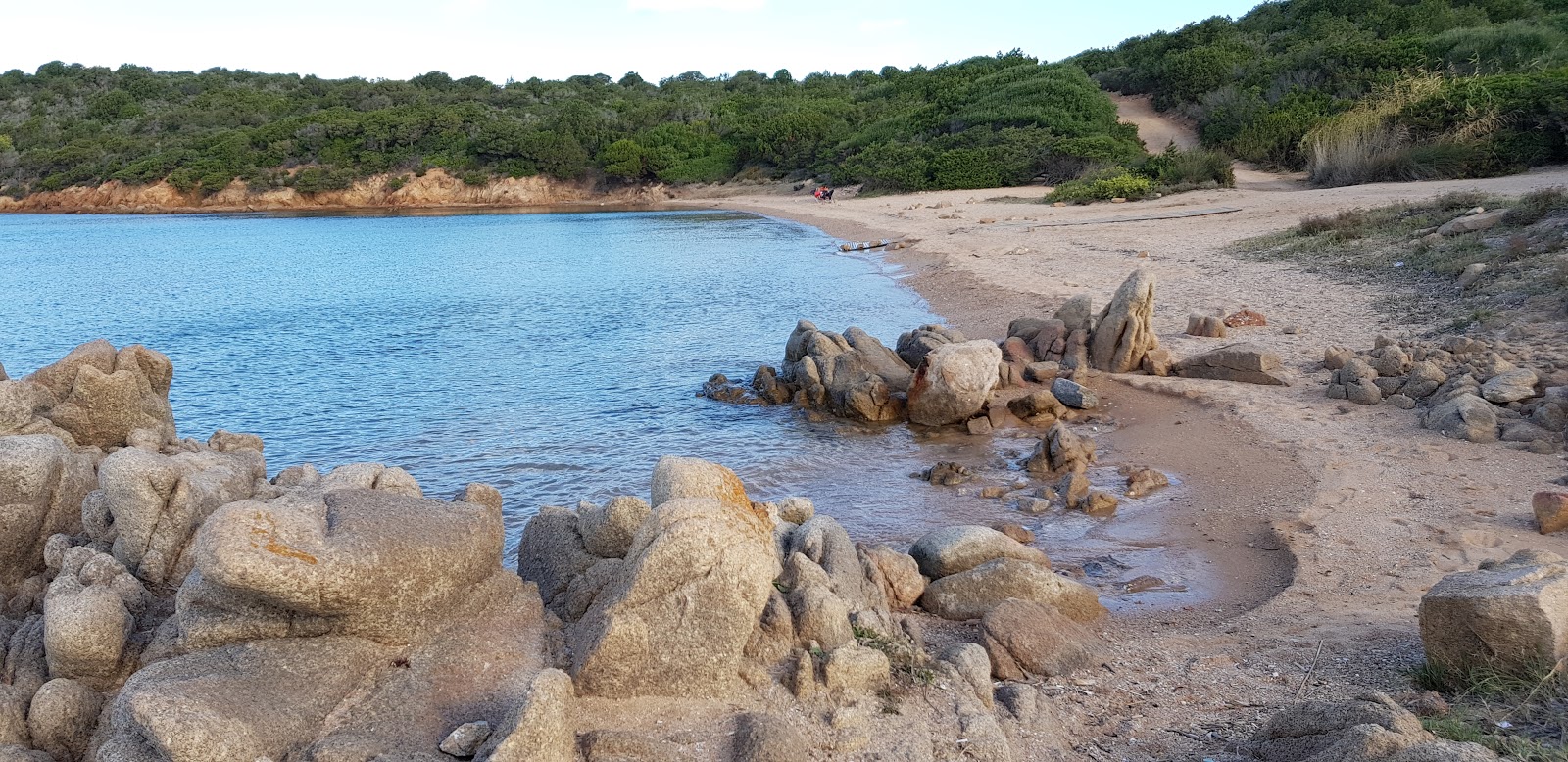 Foto di Porto Palma beach con una superficie del piccoli ciottoli bianchi