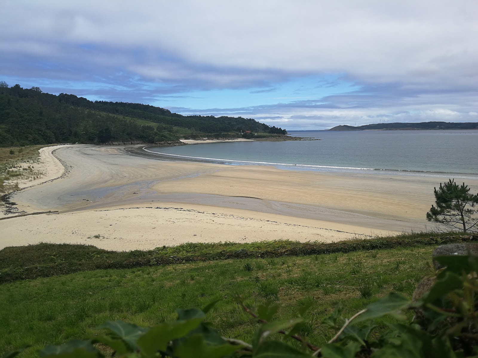 Foto di Praia de Merexo con una superficie del acqua cristallina