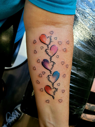 Explore back of the arm tattoo ideas, creative tattoo ideas in Warrensburg, available at Altered Visions Tattoo Studio