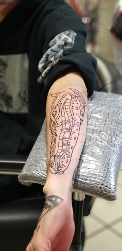 Explore amazing grace tattoo ideas, creative tattoo ideas in Bowling Green, available at The Mad Tatter, L.L.C.
