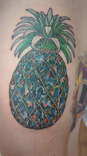Explore beach tattoo ideas for guys, creative tattoo ideas in Honolulu, available at Skin Deep Tattoo and Piercing Waikiki