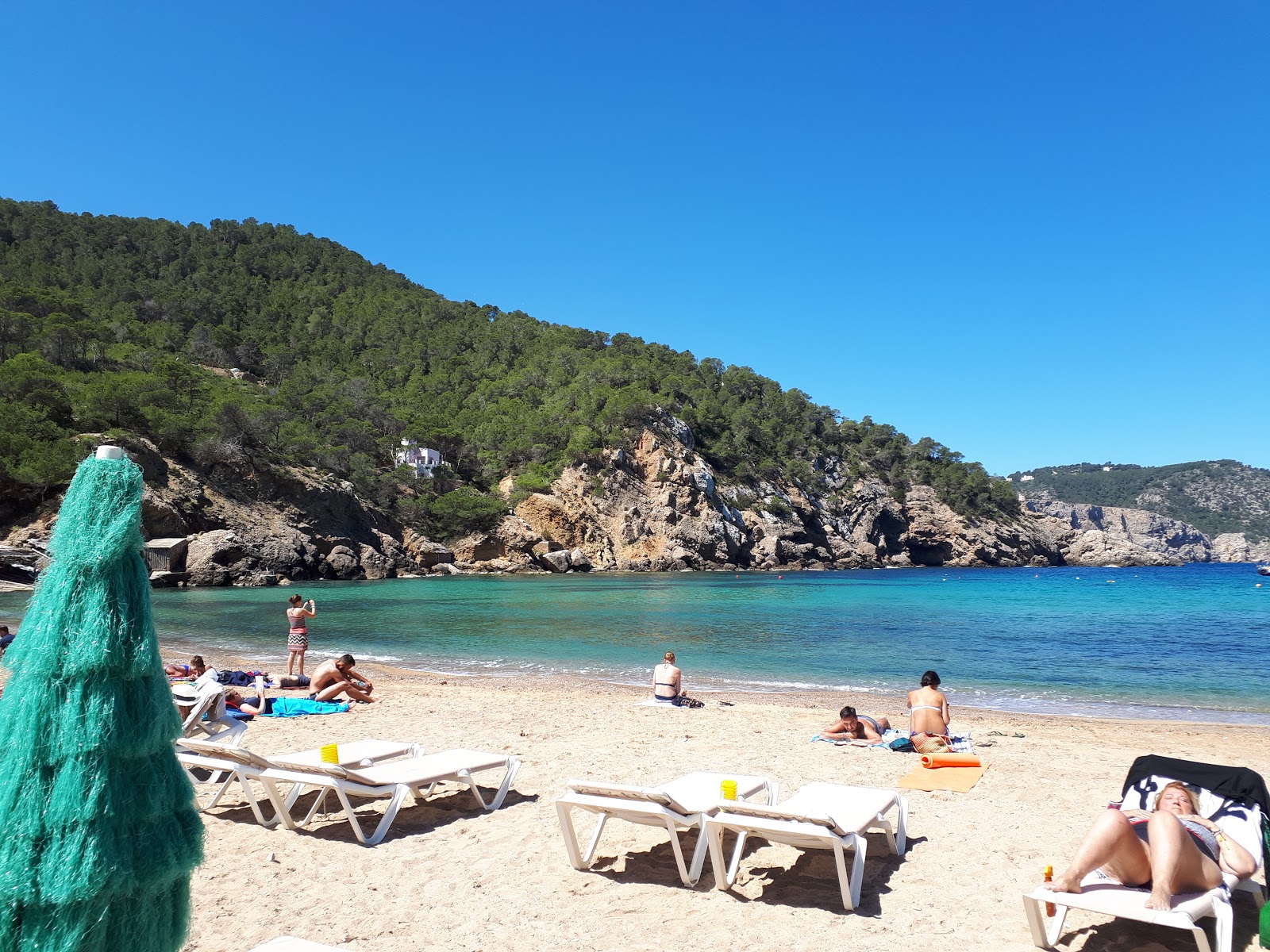 Photo of Cala Benirras with turquoise pure water surface