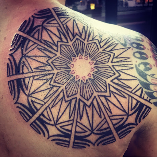 Explore tattoo ideas for men's back, creative tattoo ideas in Tecumseh, available at Lucid Tattoo Gallery