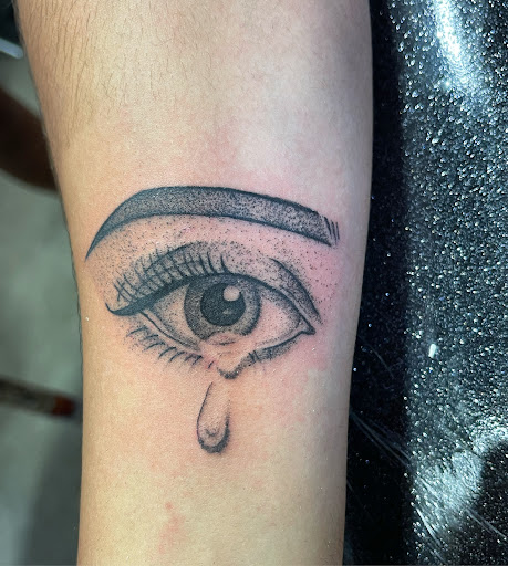 Explore letter tattoo cover up ideas, creative tattoo ideas in Saratoga Springs, available at Shark Tooth Tattoo Co