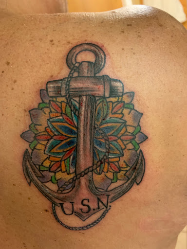 Explore feather tattoo ideas for men, creative tattoo ideas in Gulfport, available at Jack & Dianes Tattoo