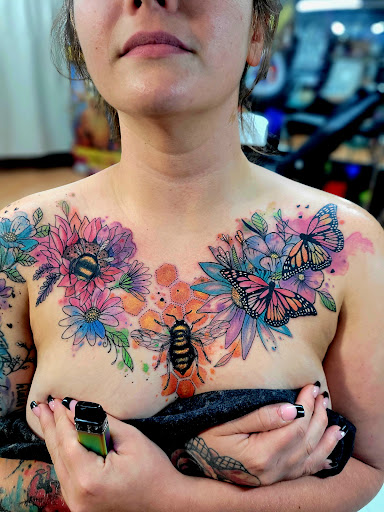 Explore mens country tattoo ideas, creative tattoo ideas in Benton, available at Spectrum Tattoo