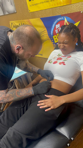 Explore cover up lower back tattoo ideas, creative tattoo ideas in Killeen, available at LaRudes Tattoos