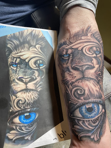 Explore middle finger tattoo ideas, creative tattoo ideas in Coeur D Alene, available at 2 Ravens Tattoo Studio