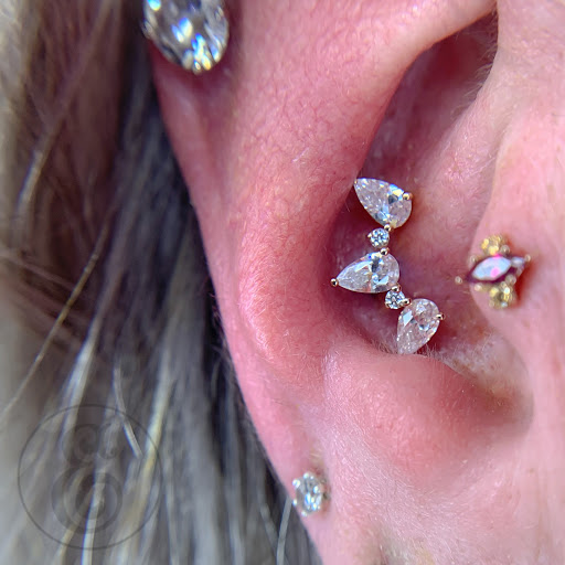 Explore cosmos flower tattoo ideas, creative tattoo ideas in Worcester, available at Elegance Piercing & Tattoo Inc.