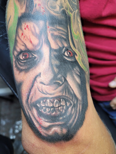 Explore black ink tattoo ideas, creative tattoo ideas in Angola, available at Hoodlum Ink