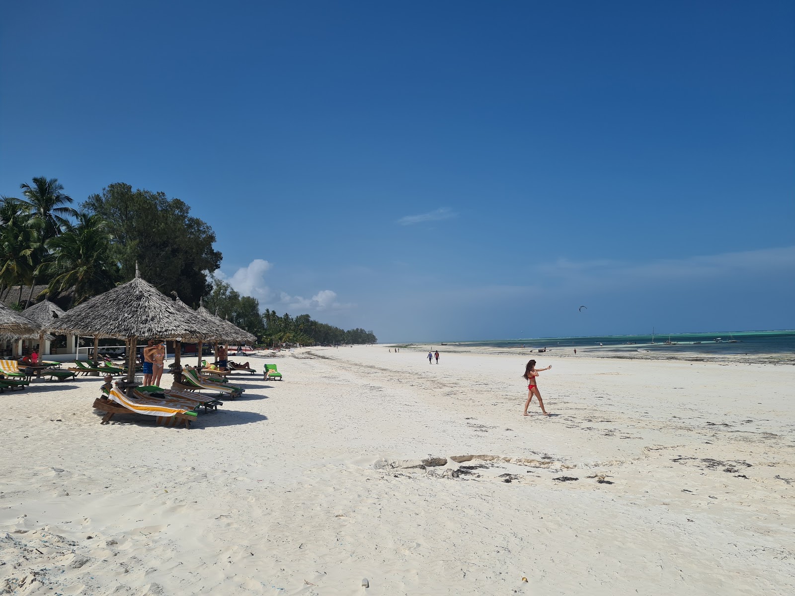 Photo of Kiwengwa Beach with white fine sand surface