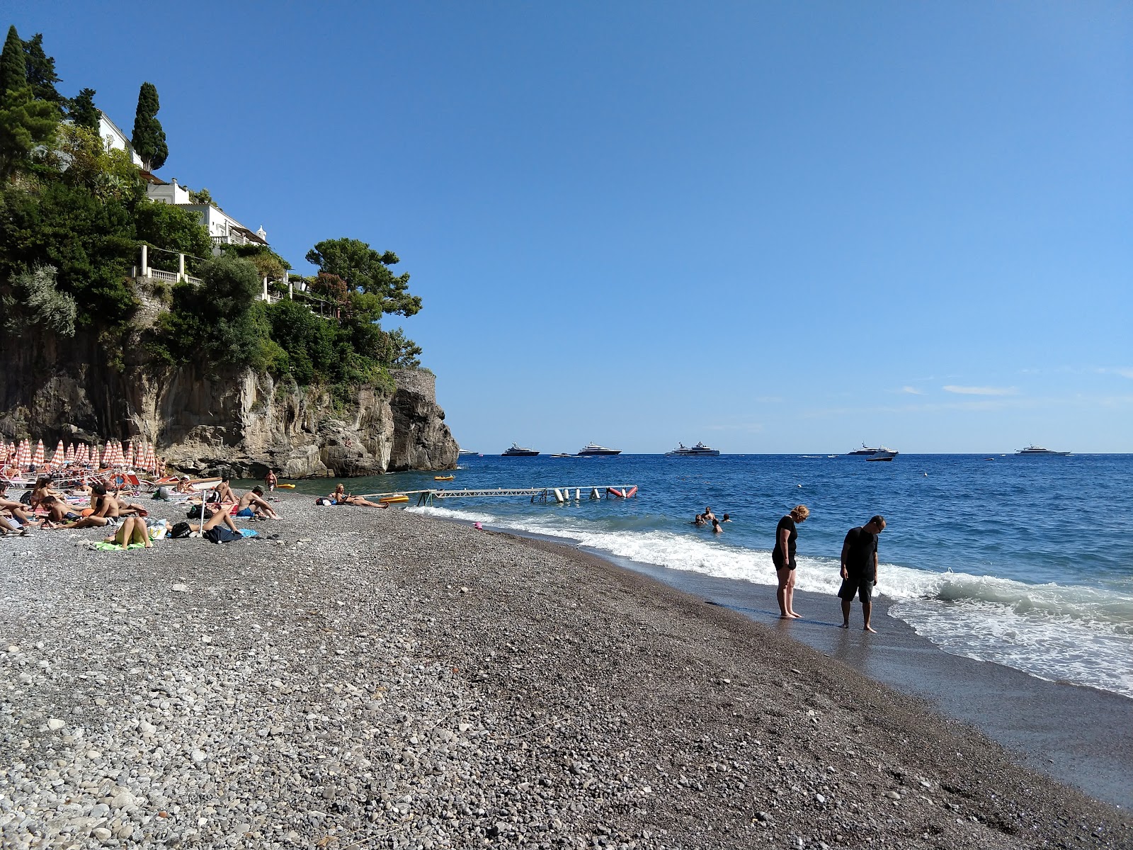 Photo of Arienzo beach with blue pure water surface