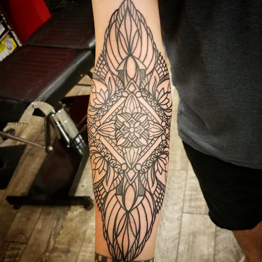 Find skull tattoo idea for your next unique tattoo in Lakeland at Black Swan Tattoo