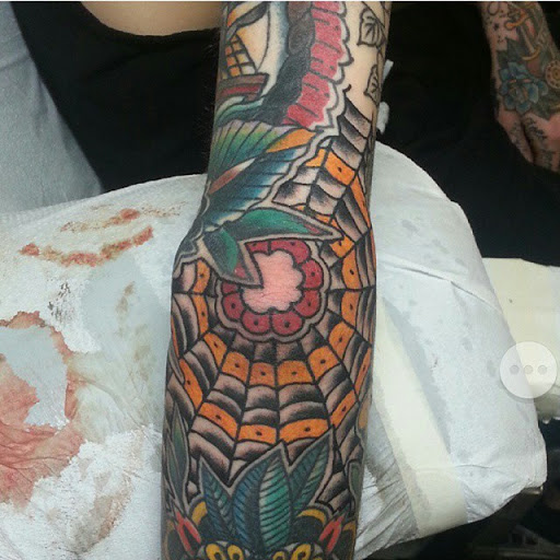 Explore vertical tattoo ideas, creative tattoo ideas in Temple, available at Lucky In Love Tattoo