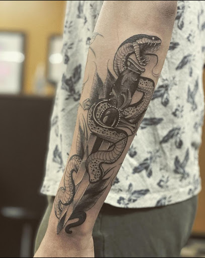 Explore arm tattoo men ideas, creative tattoo ideas in Stevens Point, available at Black Rabbit Tattooing