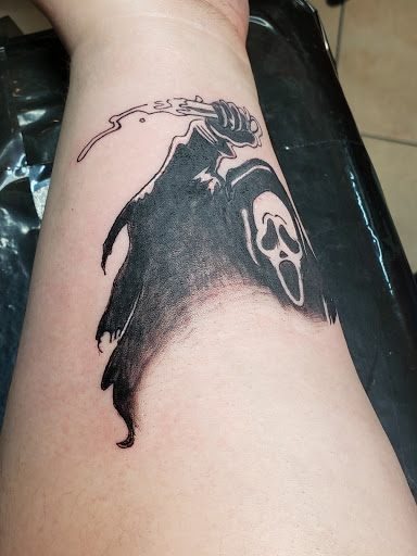 Explore photographer tattoo ideas, creative tattoo ideas in Glendale, available at Ritual Addictions Tattoo and Piercing