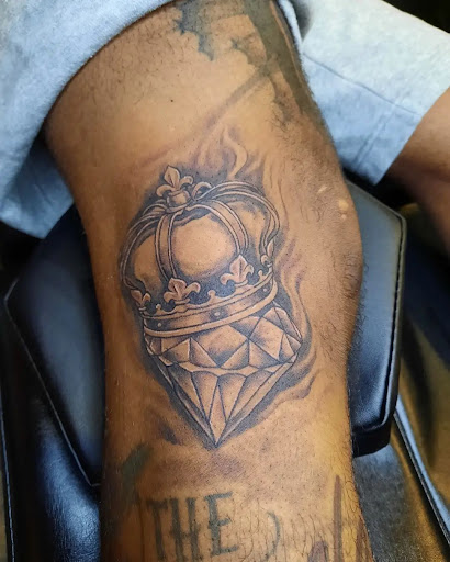 Explore tattoo ideas for breast cancer ribbon, creative tattoo ideas in Jonesboro, available at Gallery Of Ink Tattoo Shop