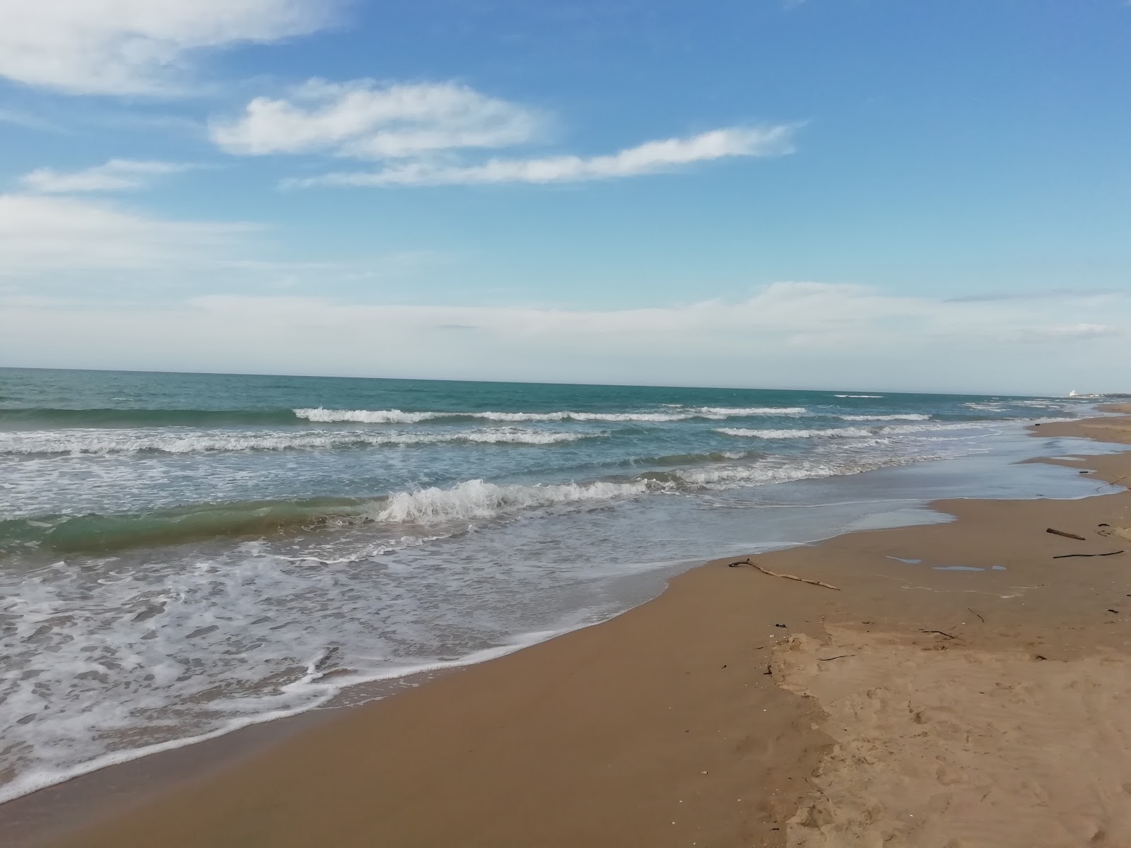Foto van Spiaggia di Tammaricella met turquoise puur water oppervlakte