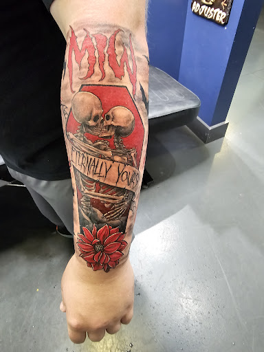 Explore handcuff tattoo ideas, creative tattoo ideas in Destin, available at Atomic Frog Tattoo