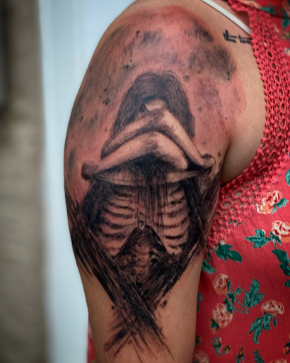 Explore lower back tattoo cover up ideas, creative tattoo ideas in Brunswick, available at Brunswick Tattoo Company