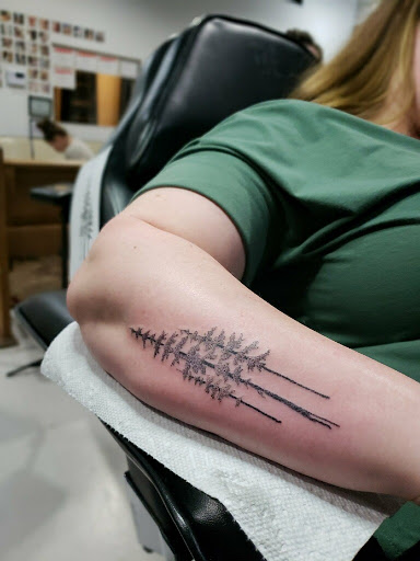 Explore american football tattoo ideas, creative tattoo ideas in Lufkin, available at Black Spot Tattoo Company