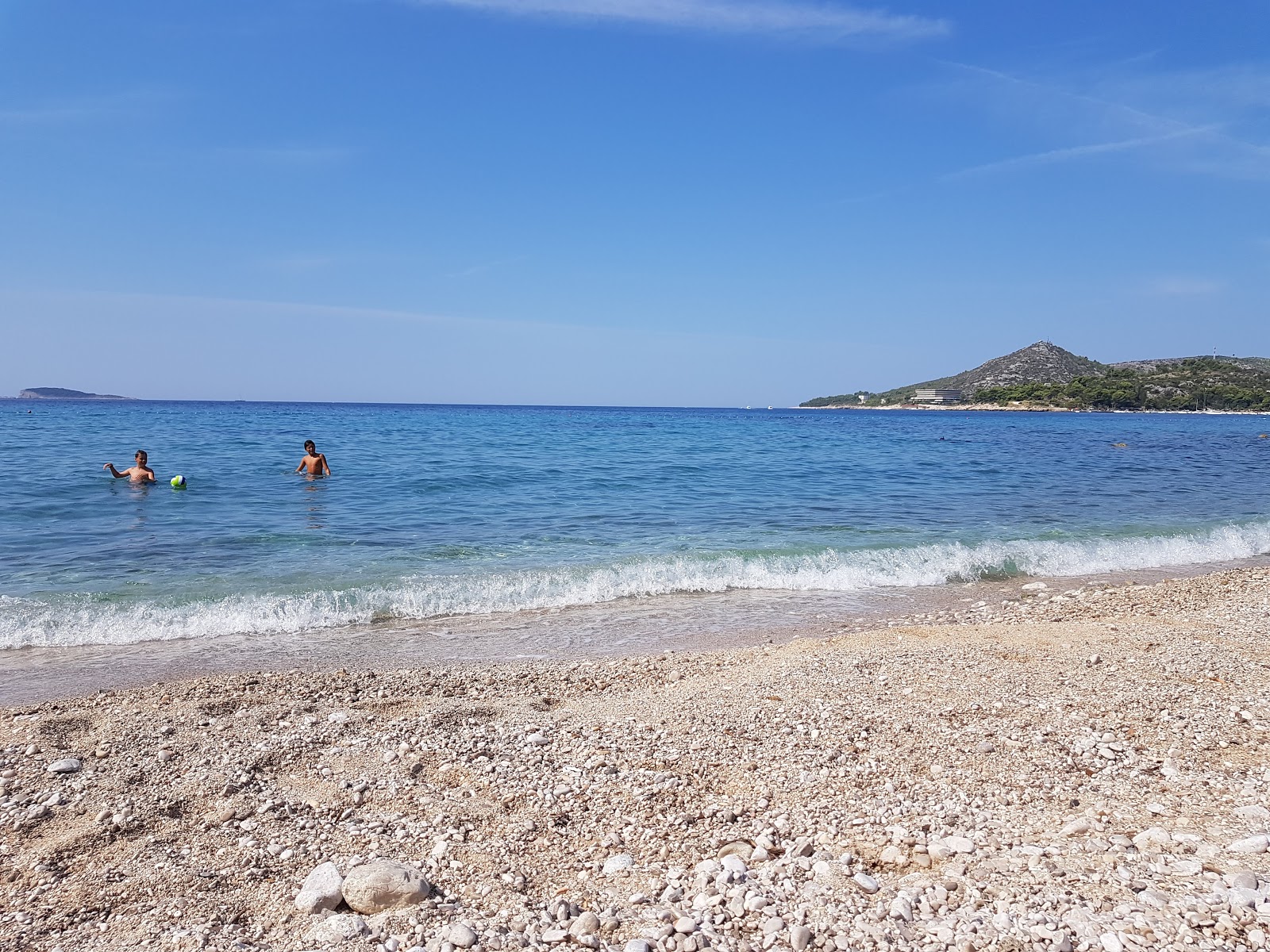 Foto van Astarea beach met turquoise puur water oppervlakte