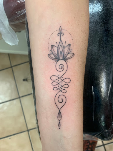 Explore jawline tattoo ideas, creative tattoo ideas in Tampa, available at Angel Tattoo