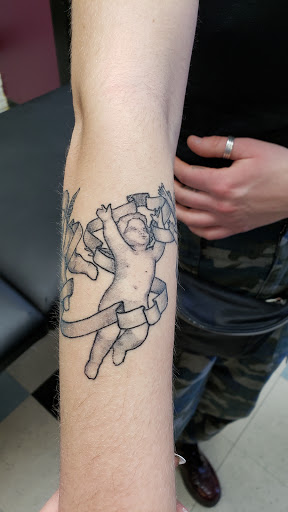 Explore barber tattoo ideas, creative tattoo ideas in Milwaukee, available at Bay Street Tattoo Co.