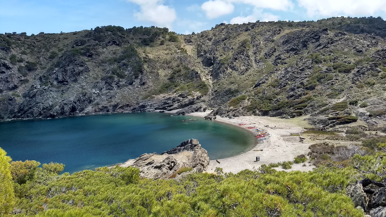Photo of Cala Tavallera with turquoise pure water surface