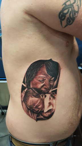 Explore bow tattoo ideas, creative tattoo ideas in Edmond, available at 15th Legion Tattoo & Body Piercing