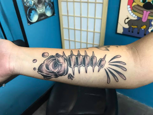Explore flower tattoo cover up ideas, creative tattoo ideas in Nampa, available at Temptation Tattoo & Body Piercing