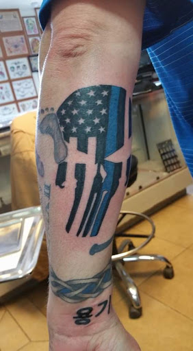 Explore aot tattoo ideas, creative tattoo ideas in Elko, available at Tom Custom Tattoos and Body Piercing Studio