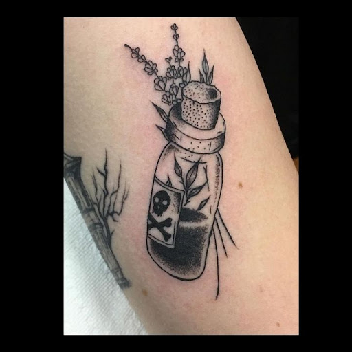 Explore elegant spine tattoo ideas, creative tattoo ideas in San Antonio, available at Wicked Ways Tattoos - Babcock