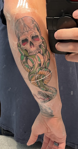 Explore tombstone movie tattoo ideas, creative tattoo ideas in Painesville, available at The Inkwell Tattoo Company