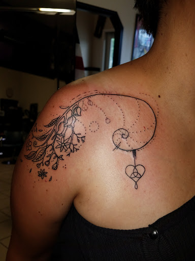 Explore rib cage tattoo ideas for guys, creative tattoo ideas in Bowling Green, available at The Mad Tatter, L.L.C.