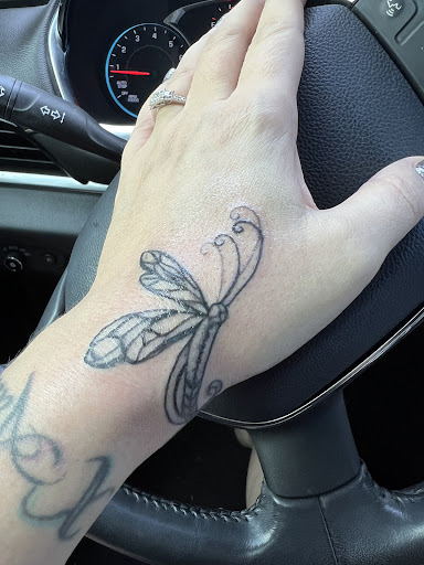 Explore rose hand tattoo ideas, creative tattoo ideas in Valdosta, available at Ink Addiction Tattoo Studio