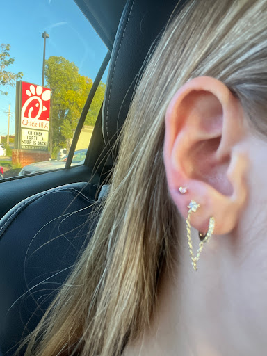 Explore thigh tattoo ideas for females, creative tattoo ideas in Omaha, available at Rowan Village Pointe