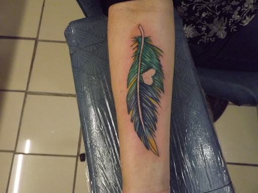 Explore toothless tattoo ideas, creative tattoo ideas in Princeton, available at Custom Dreams Tattooing and Body Piercing