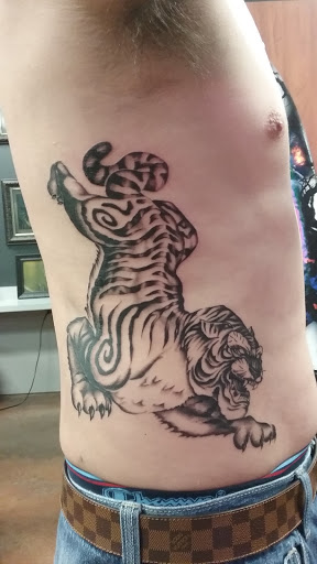 Find web tattoo ideas for your next unique tattoo in Spring Hill at Tattoo Company