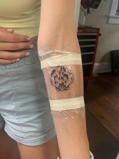 Explore ear tattoo ideas for women, creative tattoo ideas in North Charleston, available at Blu Gorilla Tattoo