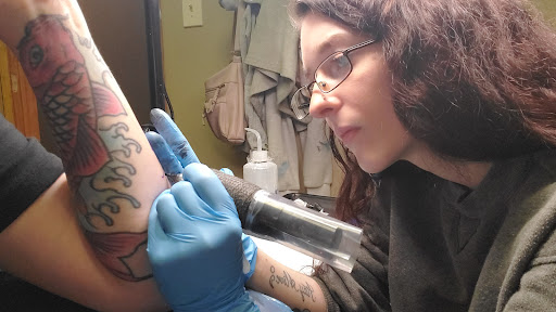 Explore family tattoo ideas for guys on arm, creative tattoo ideas in Holly, available at Loyalty Tattoo Company