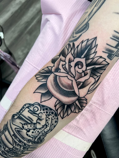 Explore hand skull tattoo ideas, creative tattoo ideas in Fort Wayne, available at Attraction Tattoos