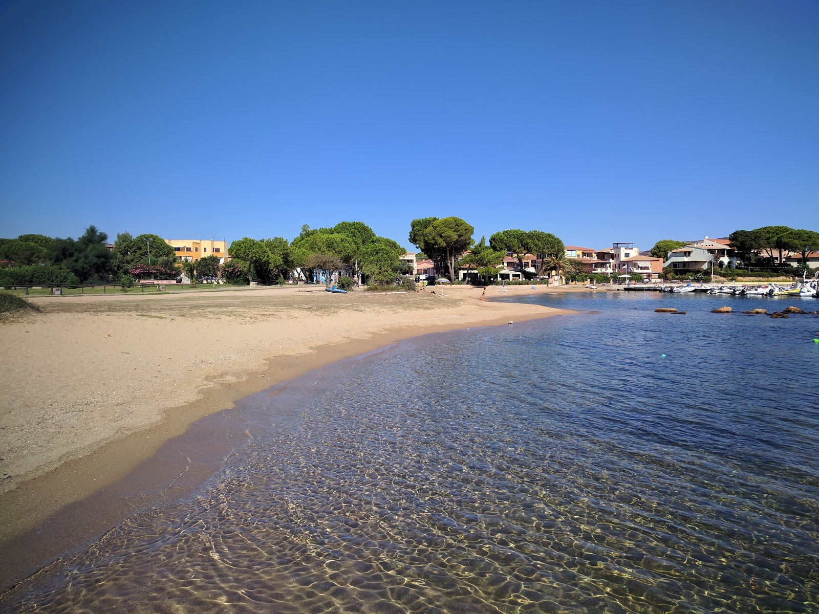 Photo of Porto San Paolo with brown sand surface