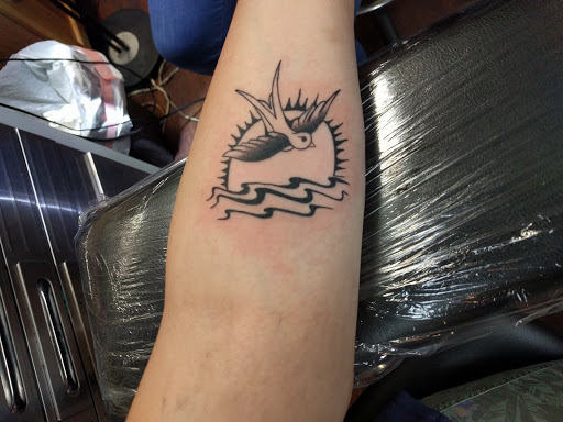 Explore cover up neck tattoo ideas, creative tattoo ideas in Linden, available at Tattooville & Body Piercing