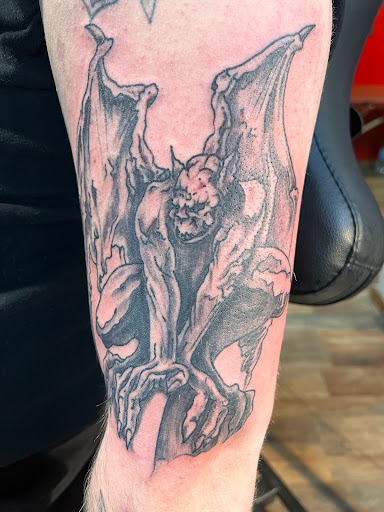 Explore tramp stamp tattoo cover up ideas, creative tattoo ideas in Pikeville, available at The Carbon Canary Tattoo Studio