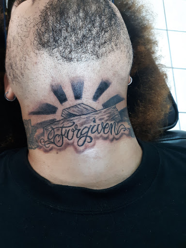 Explore chest piece tattoo ideas for men, creative tattoo ideas in Eunice, available at Supreme Ink Tattoo & Piercing