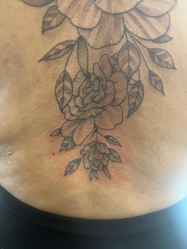 Explore pretty flower tattoo ideas, creative tattoo ideas in Mount Juliet, available at Division Street Tattoo Company