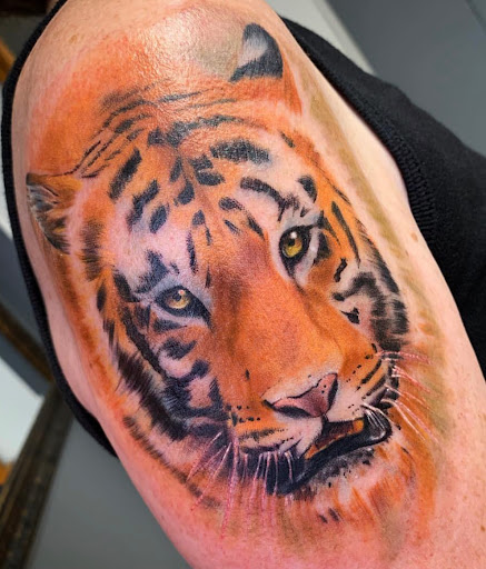 Explore lung cancer ribbon tattoo ideas, creative tattoo ideas in Transfer, available at Studio Antherium Tattoo