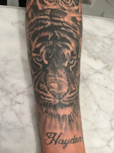 Explore sun tattoo ideas for men, creative tattoo ideas in Washington, available at Inktoxicating Tattoos